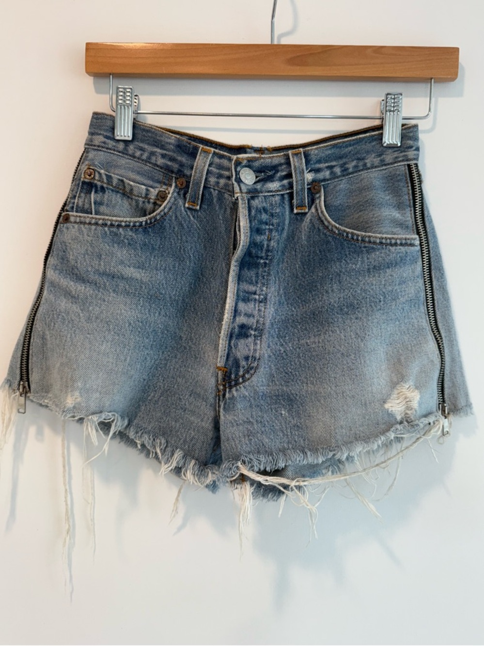 Re/Done Distressed High-Waist Denim Shorts in Light Blue with Side Zippers